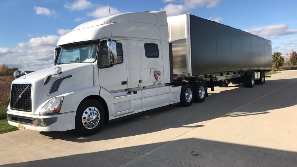 Koval Trucking flatbed truck on the road
